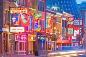 Nashville, TN, street showing neon lights at night.